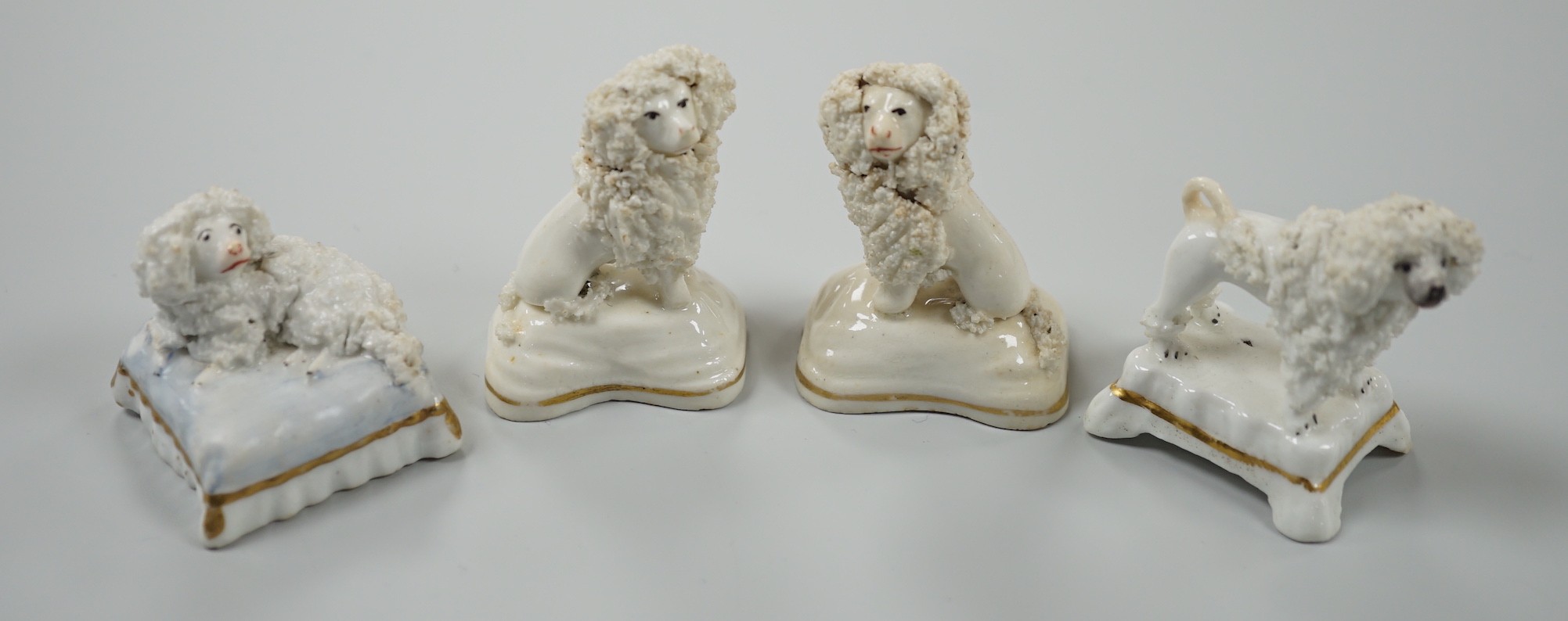 Four toy Staffordshire models of poodles, to include a pair, c.1830-50, (4). Tallest 5cm, Provence: Dennis G. Rice collection, Cf. Dennis G.Rice Dogs in English porcelain, colour plate 113